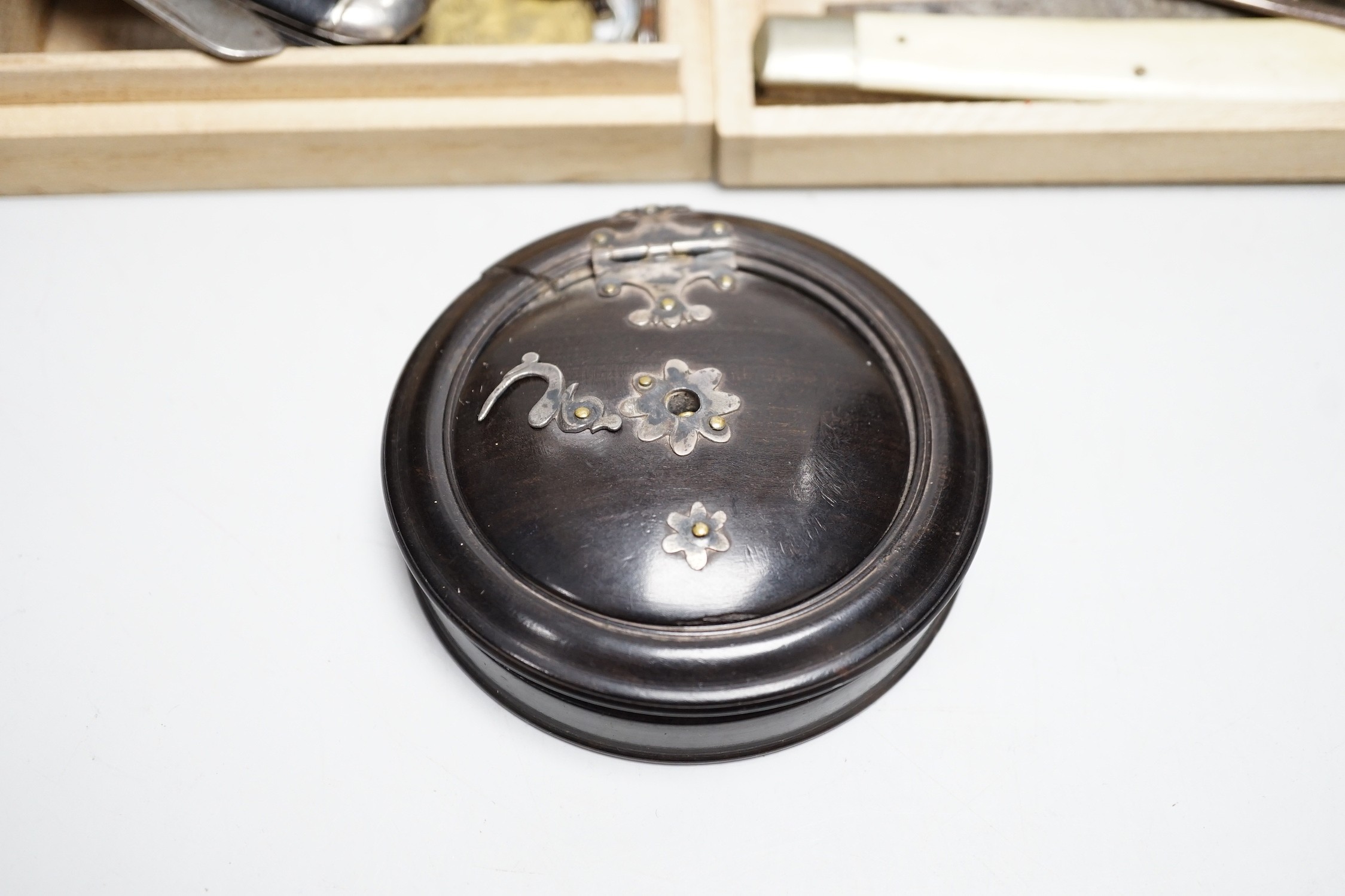 A collection of penknives, coins, a medallion and an unusual concertina box, etc.
